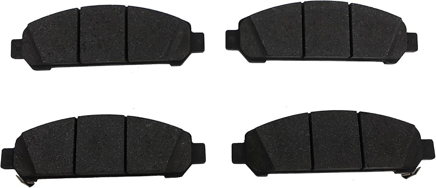 Front brake pad set with flat friction surfaces and metal backing plates for disc brake systems