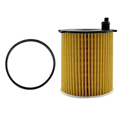 Cartridge-style oil filter kit featuring a yellow pleated paper element, a circular rubber gasket ring, and a white fiber disc on a white background