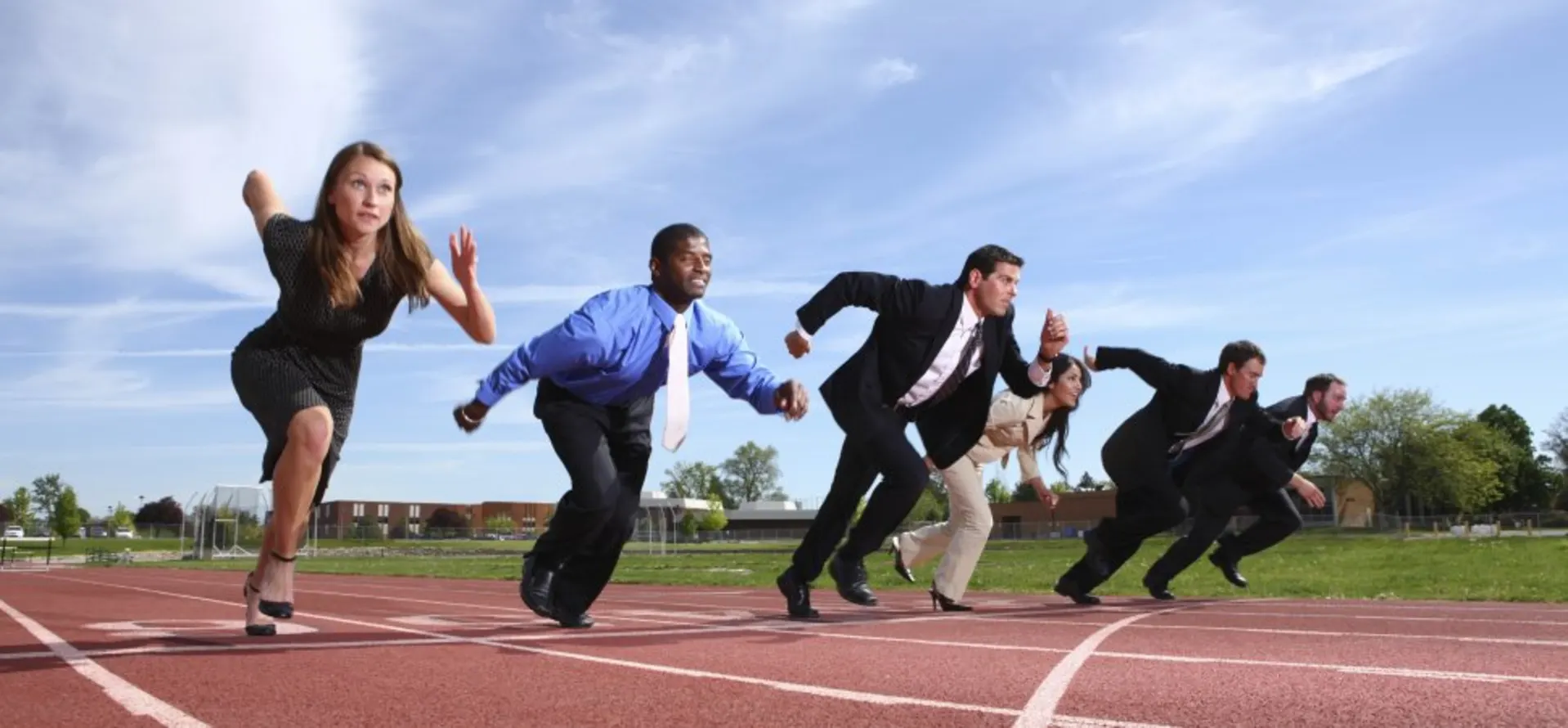 Professionals racing on a track symbolizing competition and strategic positioning in modern industries