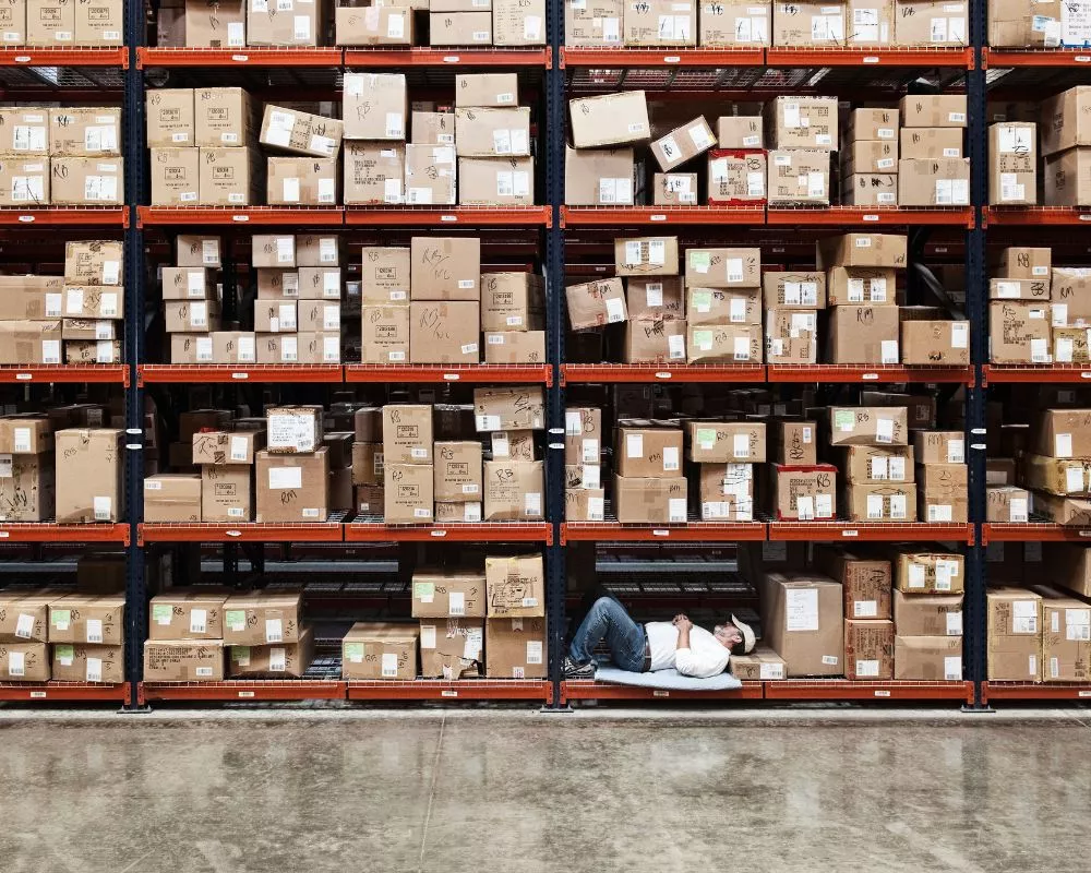 Warehouse shelves filled with slow-moving auto parts representing hidden profit loss