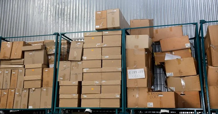 Warehouse shelves filled with slow-moving auto parts representing hidden profit loss