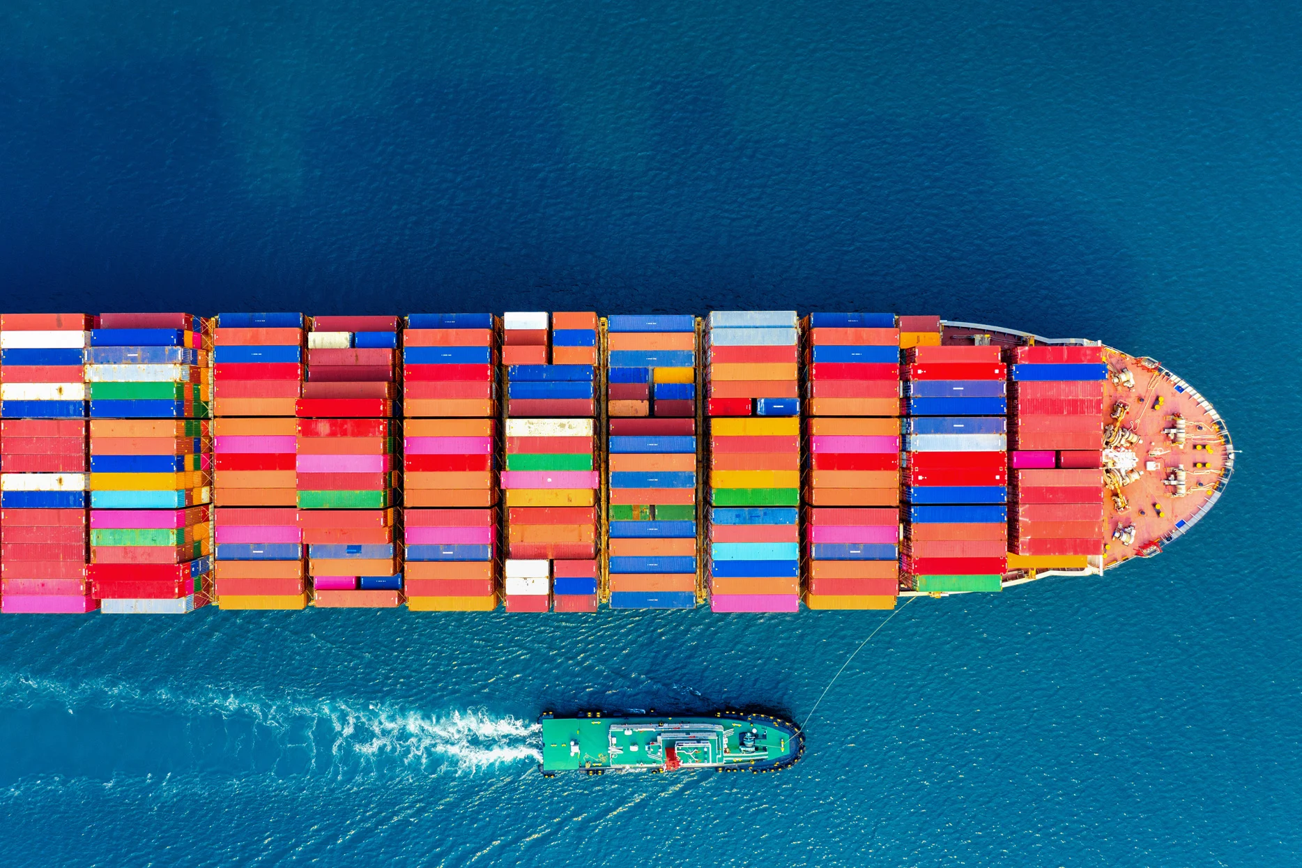 Container ship at sea representing freight volatility and cost uncertainty in international logistics