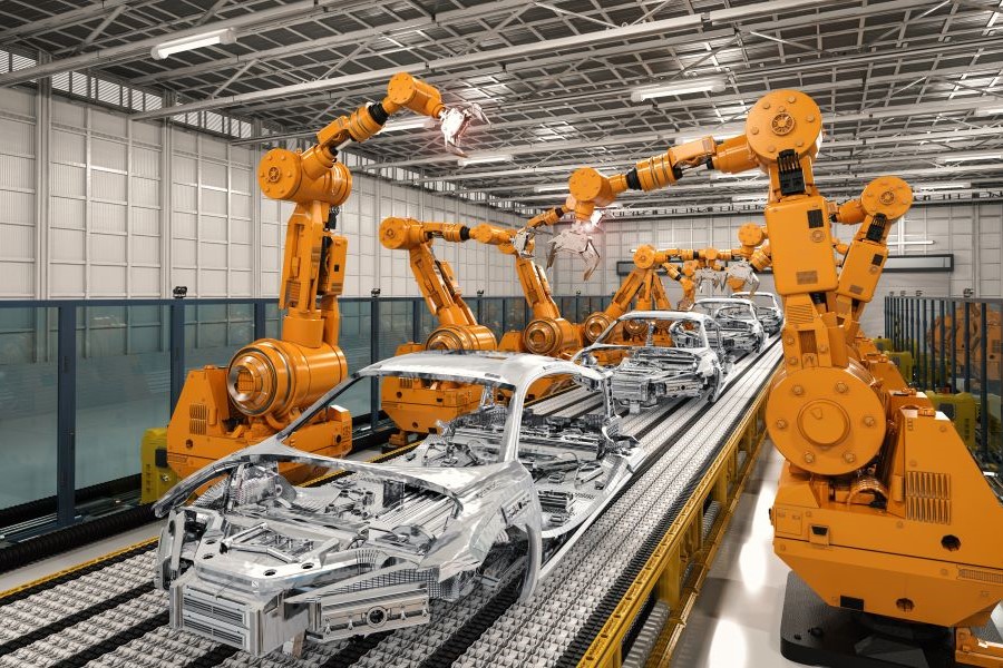 Multiple robotic arms assembling automotive body components on a standardized production line in a modern manufacturing facility.