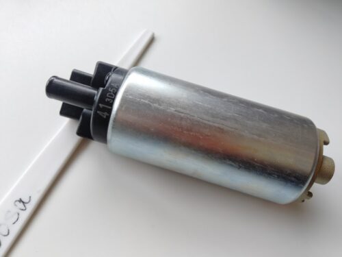 Inline fuel pump featuring smooth metallic housing with molded plastic inlet and outlet ends