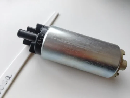 Inline fuel pump featuring smooth metallic housing with molded plastic inlet and outlet ends