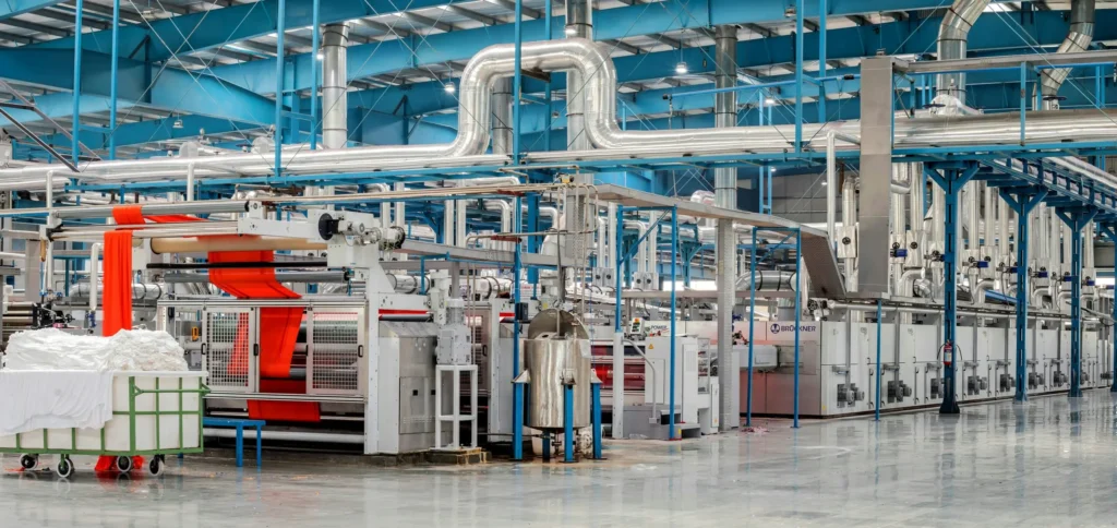 Industrial processing system inside an auto parts supplier facility symbolizing operational stability